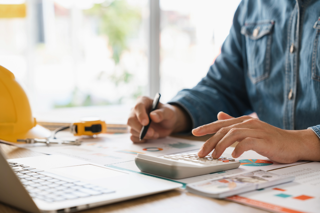 man computing construction costs